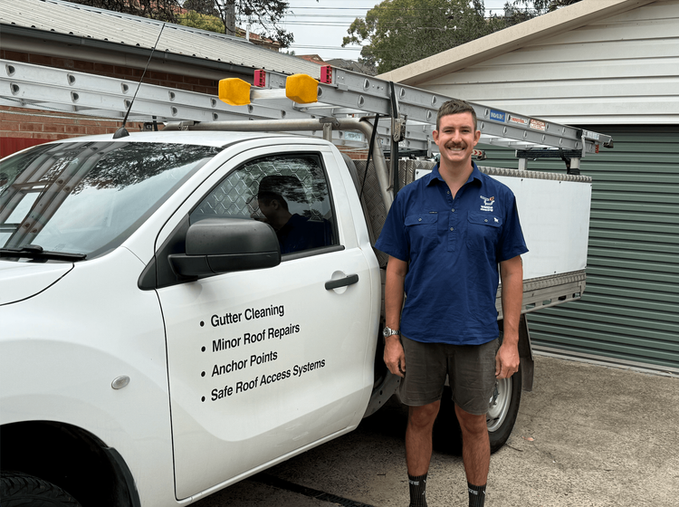 Our technician standing next to the work car.