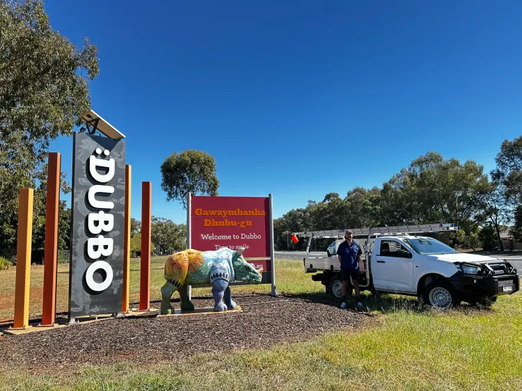 The Wattle Cleaning Ute in Front of Dubbo Town Sign